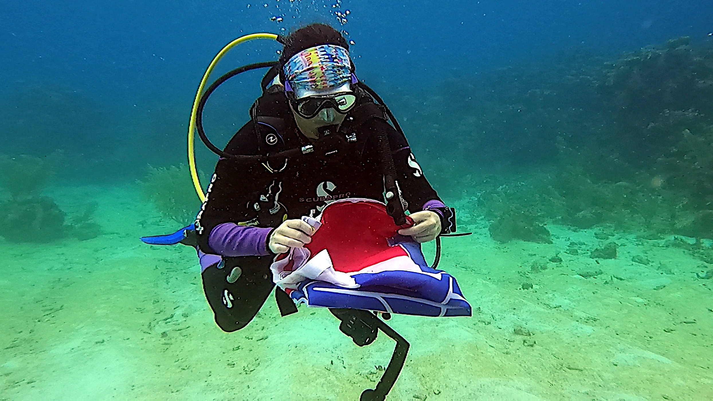 Lakediver folding up the flag